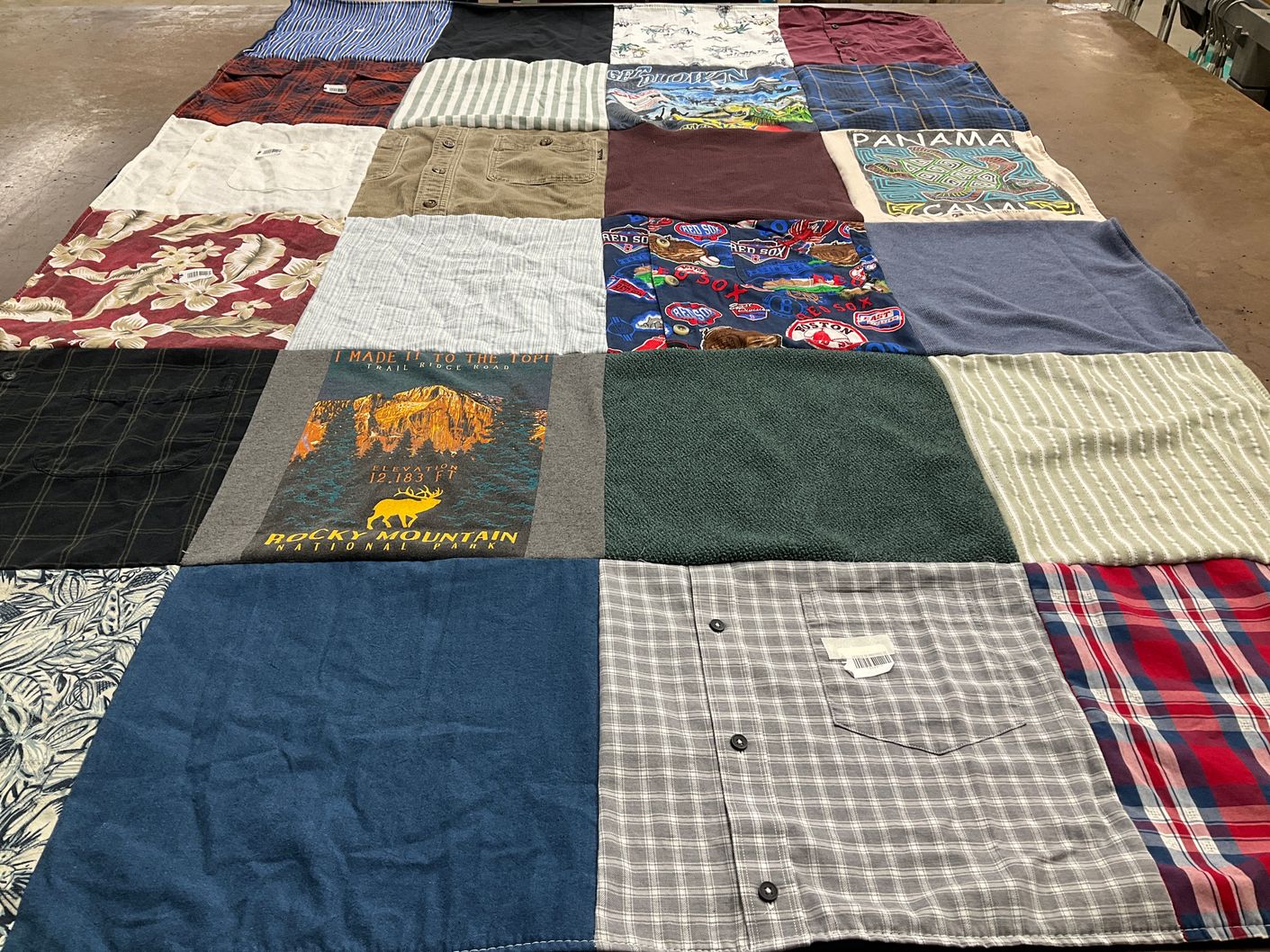 T-shirt quilt with hiking, travel themes by Kristin from NJ