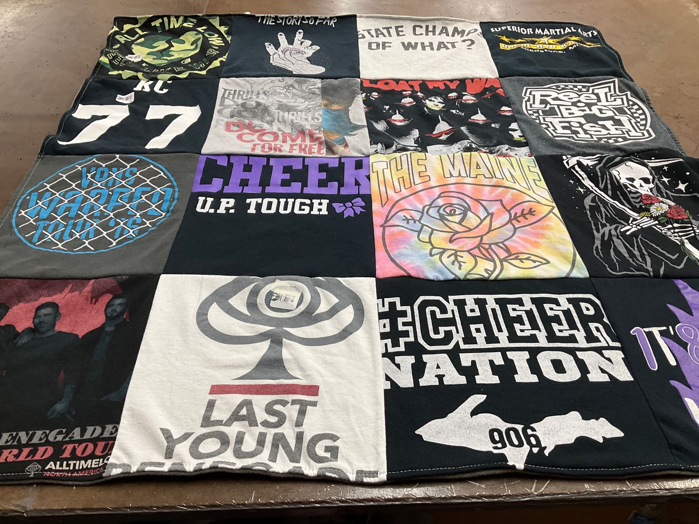 T-shirt quilt with cheerleading, music themes by Jolene from WI