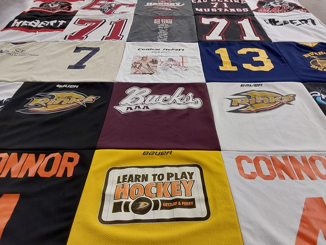 T-shirt quilt with hockey themes by Deborah from WI