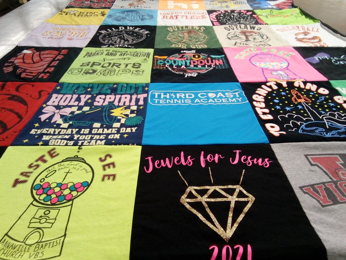 T-shirt quilt with religion, sports themes by Amy from TX
