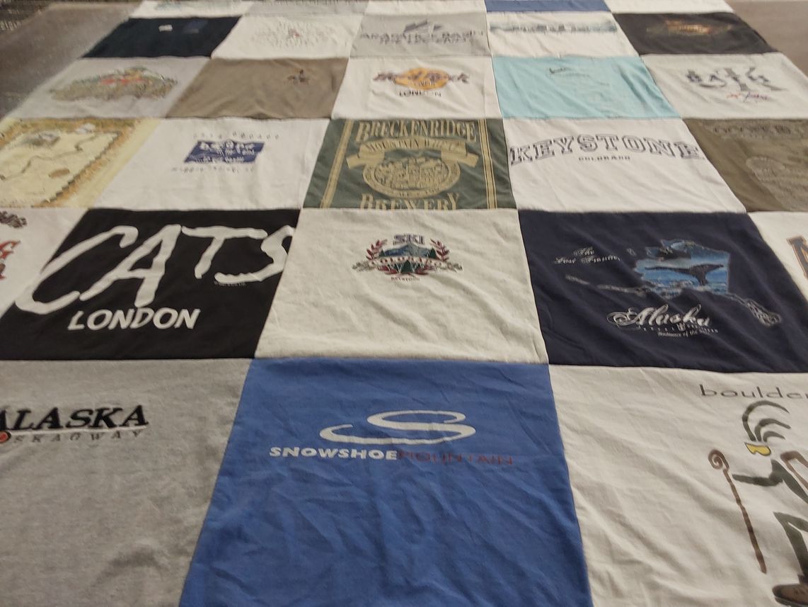 T-shirt quilt with travel, outdoor activities themes by Lisa from FL