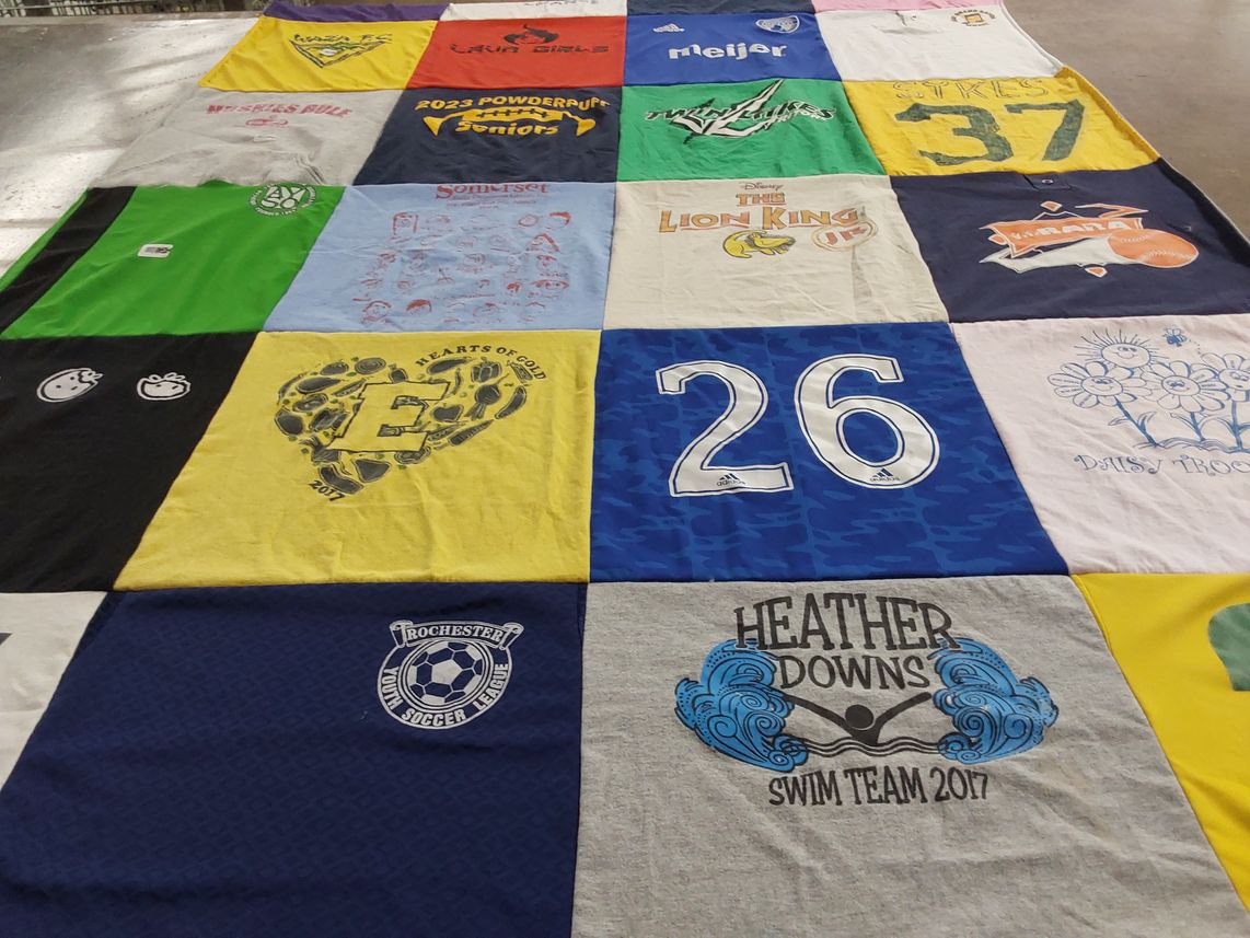 T-shirt quilt with sports, swimming themes by Julie from MI
