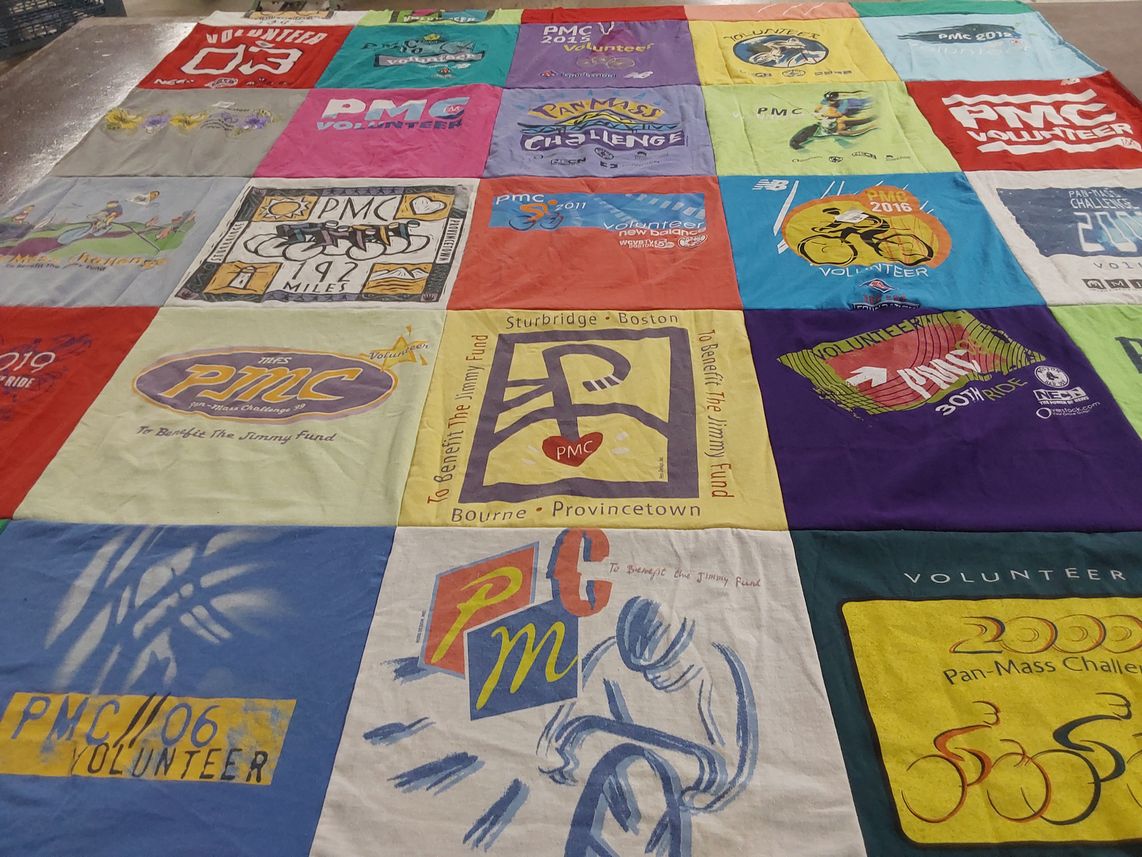 T-shirt quilt with cycling, community service themes by Deborah from MA