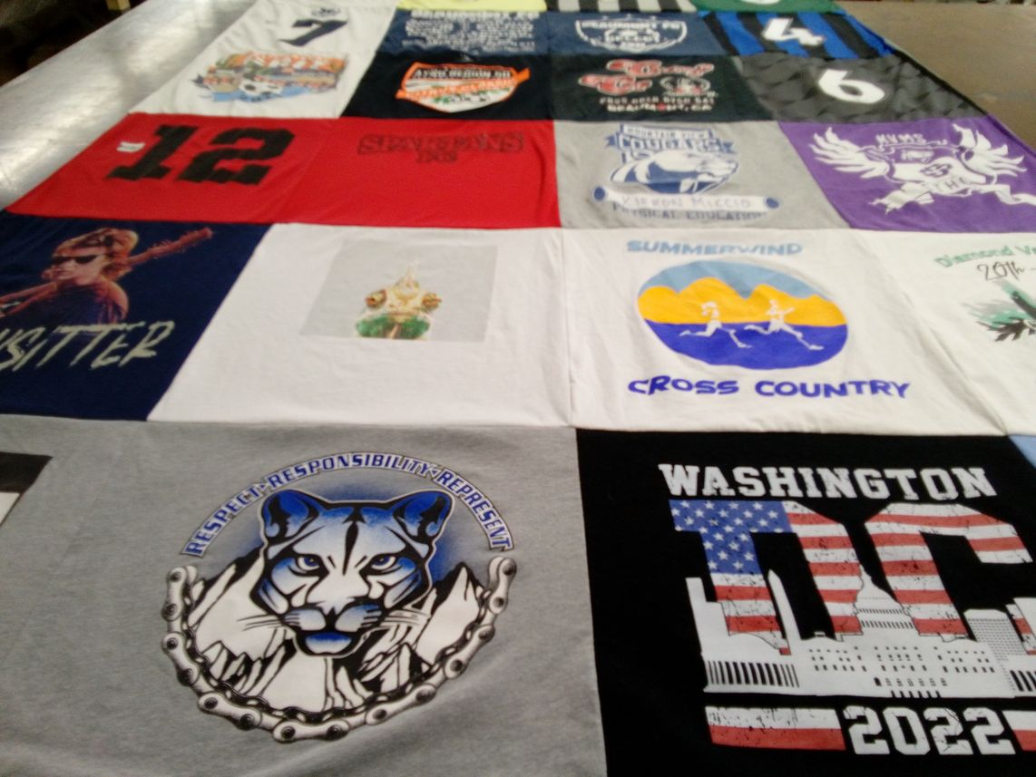 T-shirt quilt with running, sports themes by Heidi from CA
