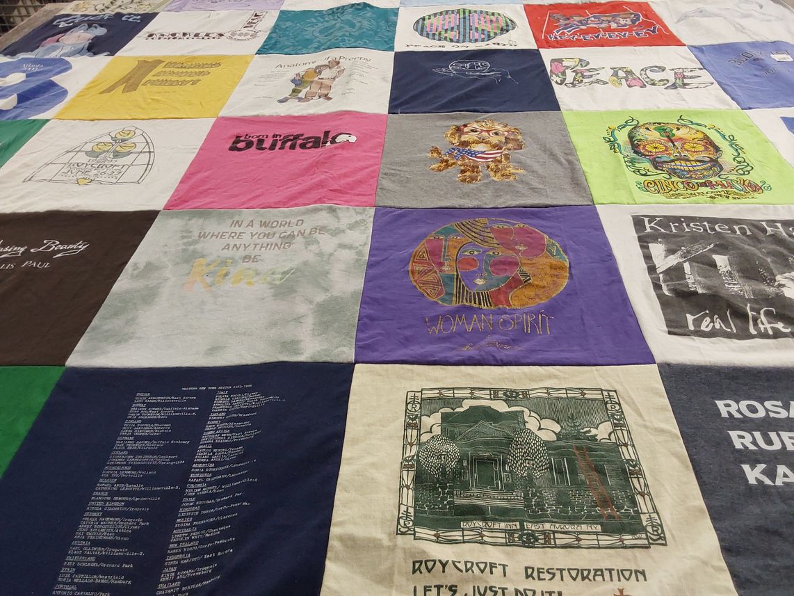 T-shirt quilt with art, community themes by Leah from NY