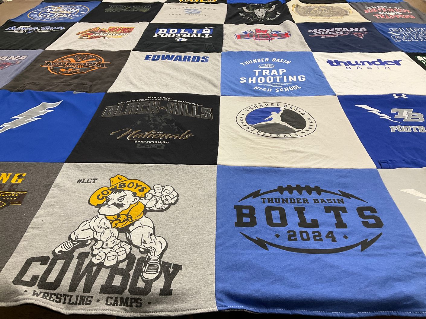 T-shirt quilt featuring thunder basin football, cowboys wrestling by Darci from WY