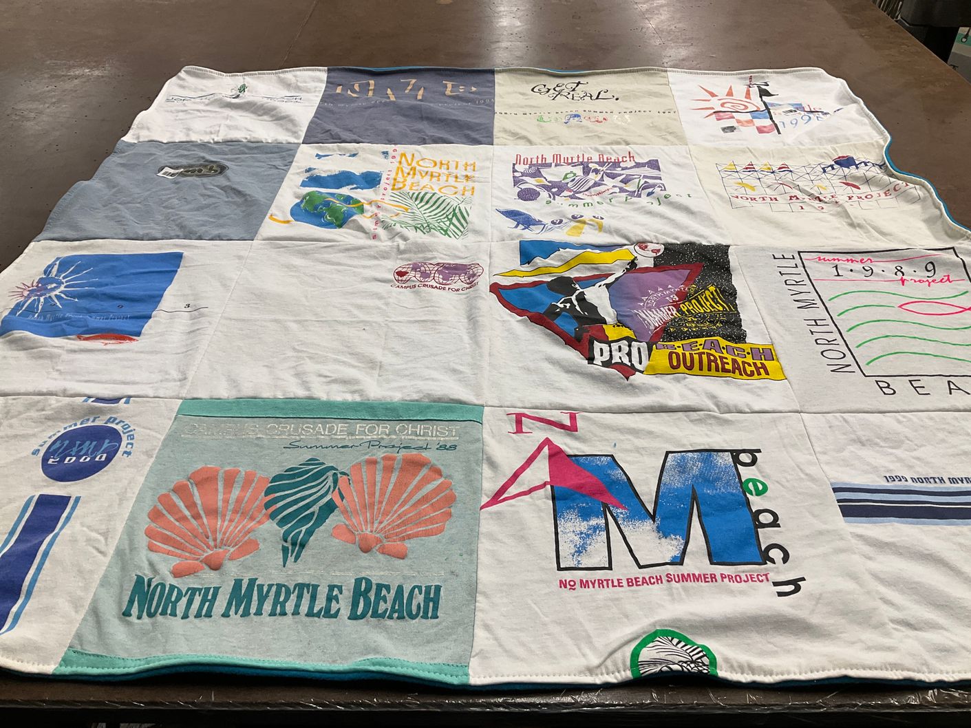 T-shirt quilt with beach, summer activities themes by Emily from NC