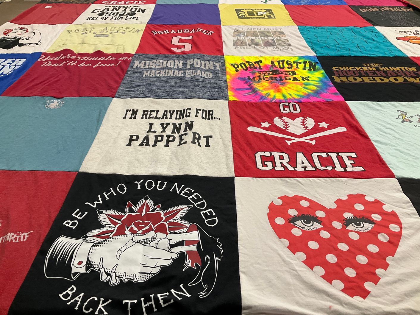 T-shirt quilt with fundraising themes by Christine from MI