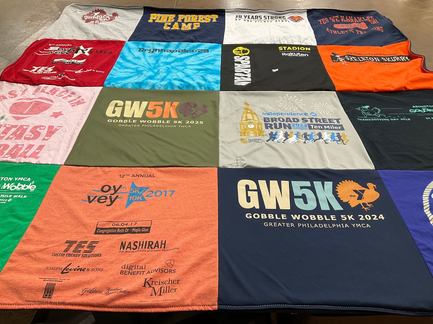 T-shirt quilt with running, community events themes by Rachel from PA