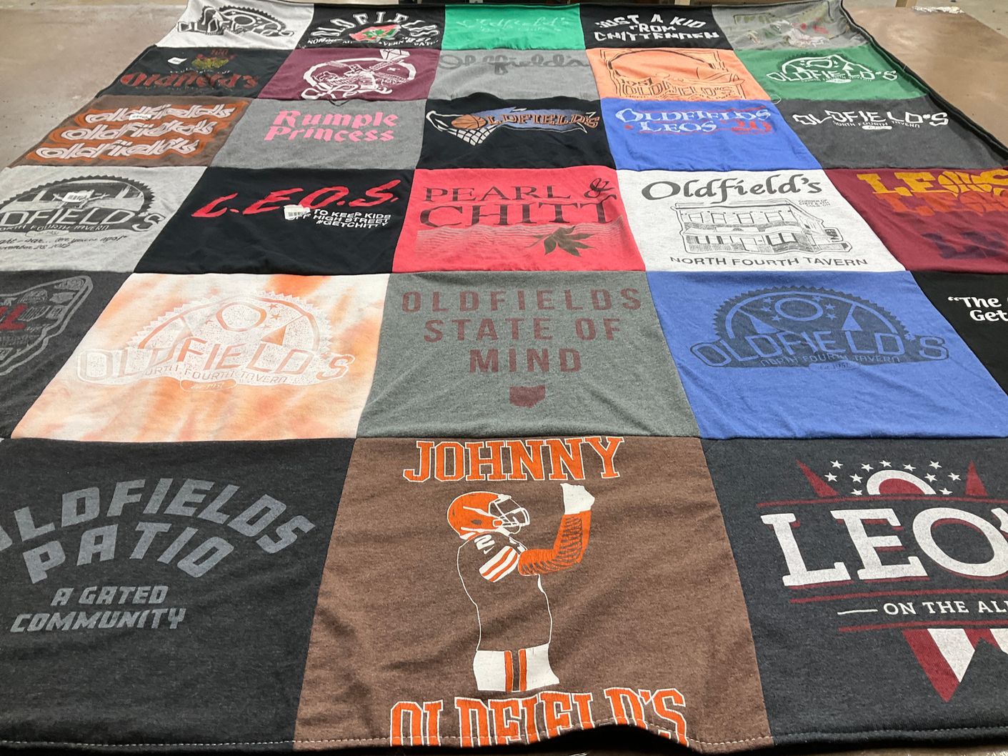 T-shirt quilt with local business, sports themes by Gabrielle from OH