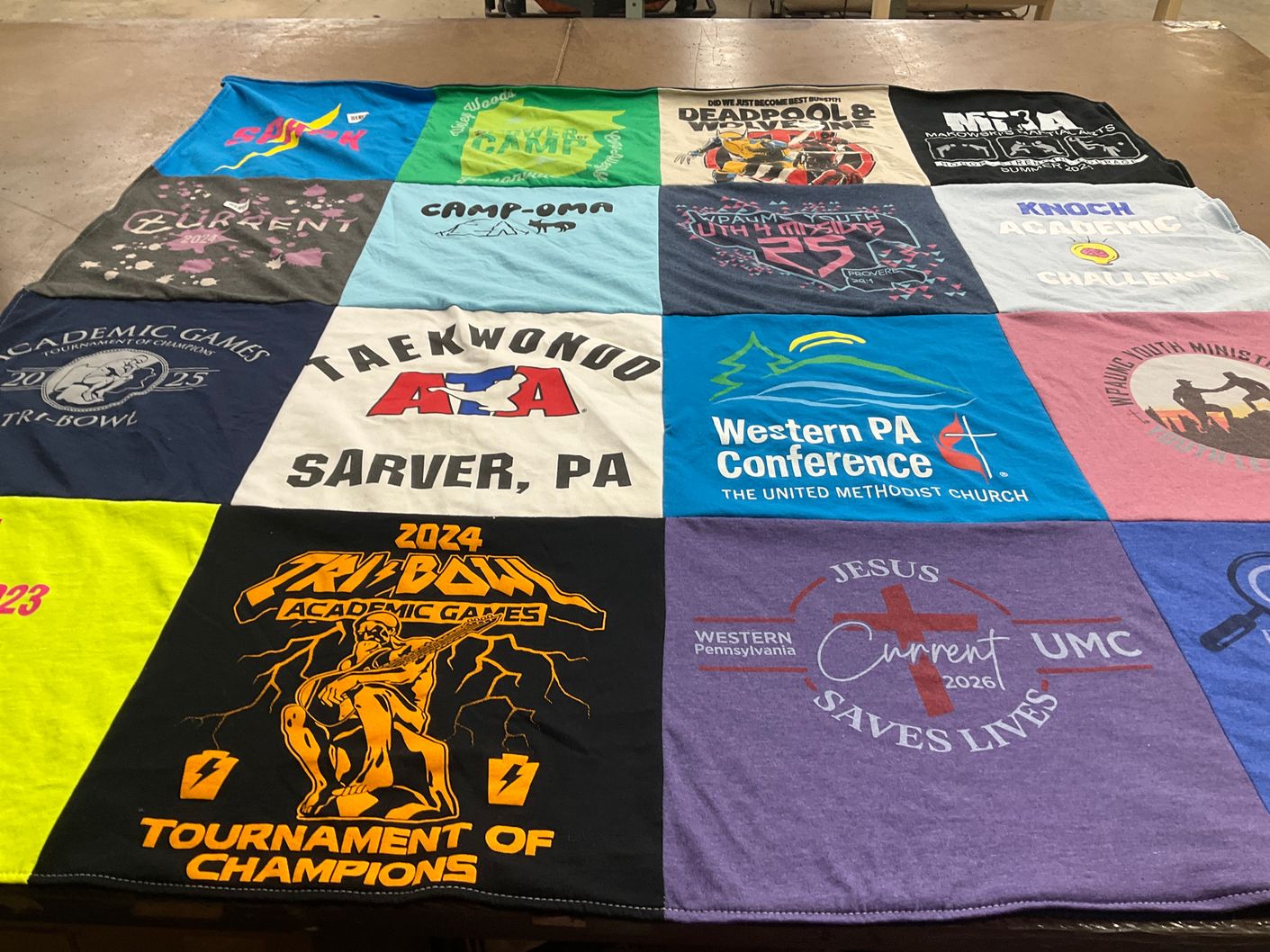 T-shirt quilt with academics, taekwondo themes by Amanda from PA