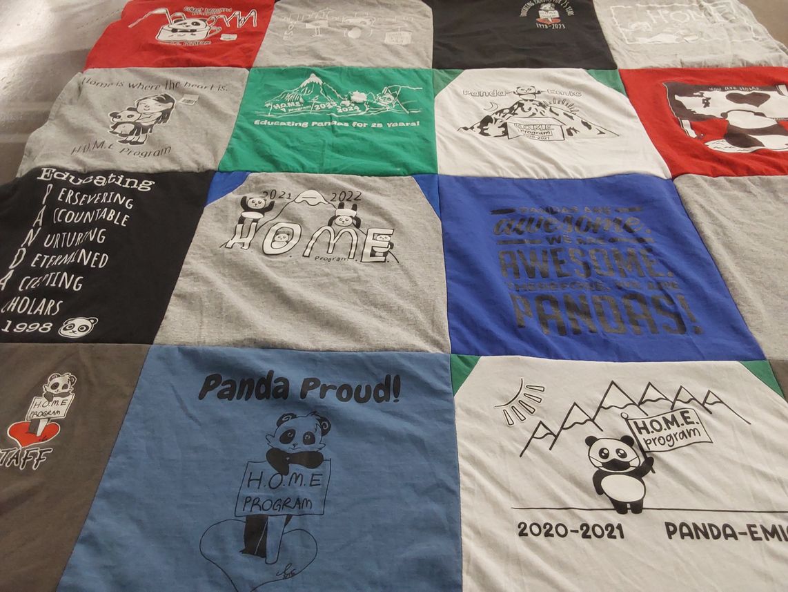 T-shirt quilt with pandas, education themes by Kathryn from WA