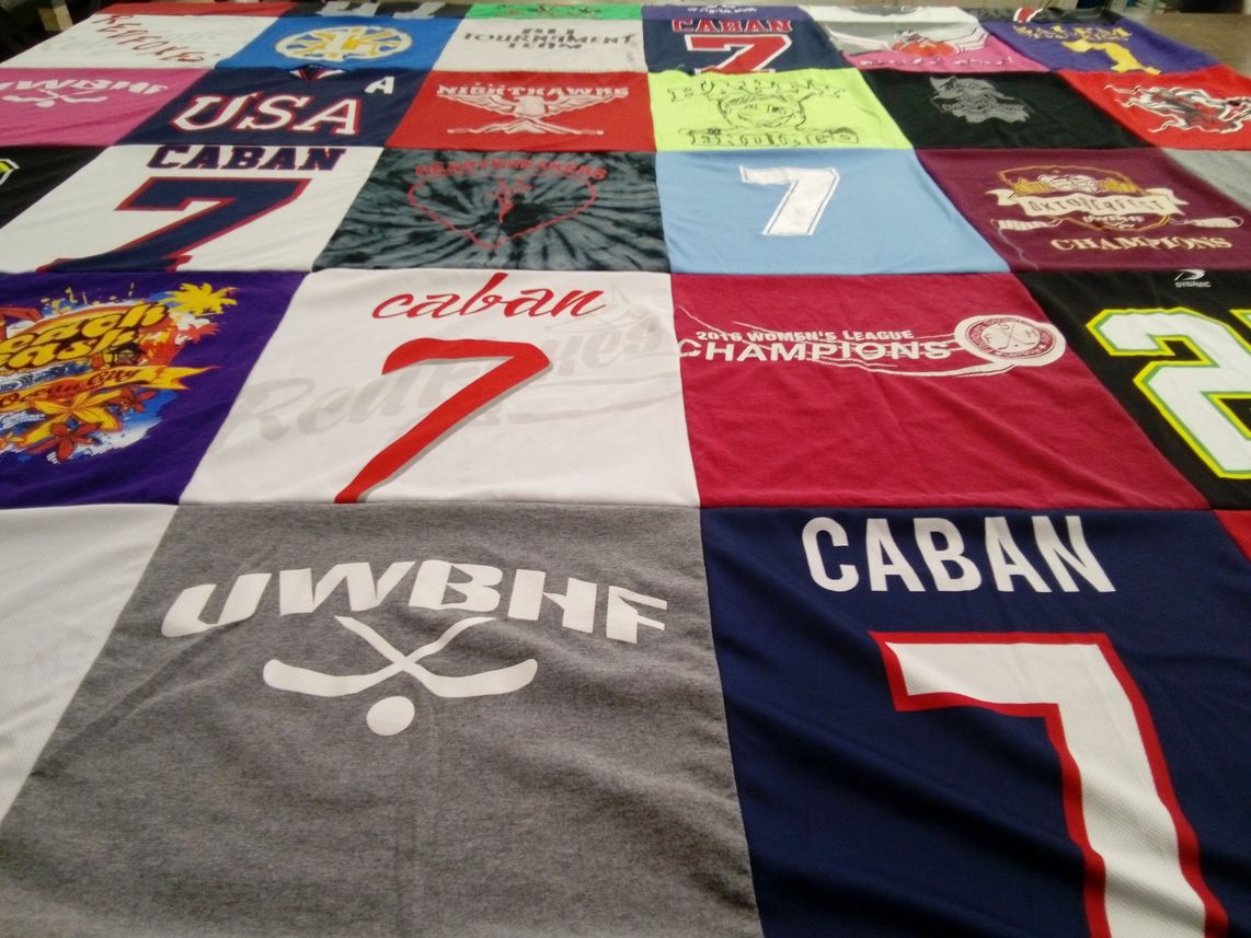 T-shirt quilt with sports, hockey themes by Robin from MA