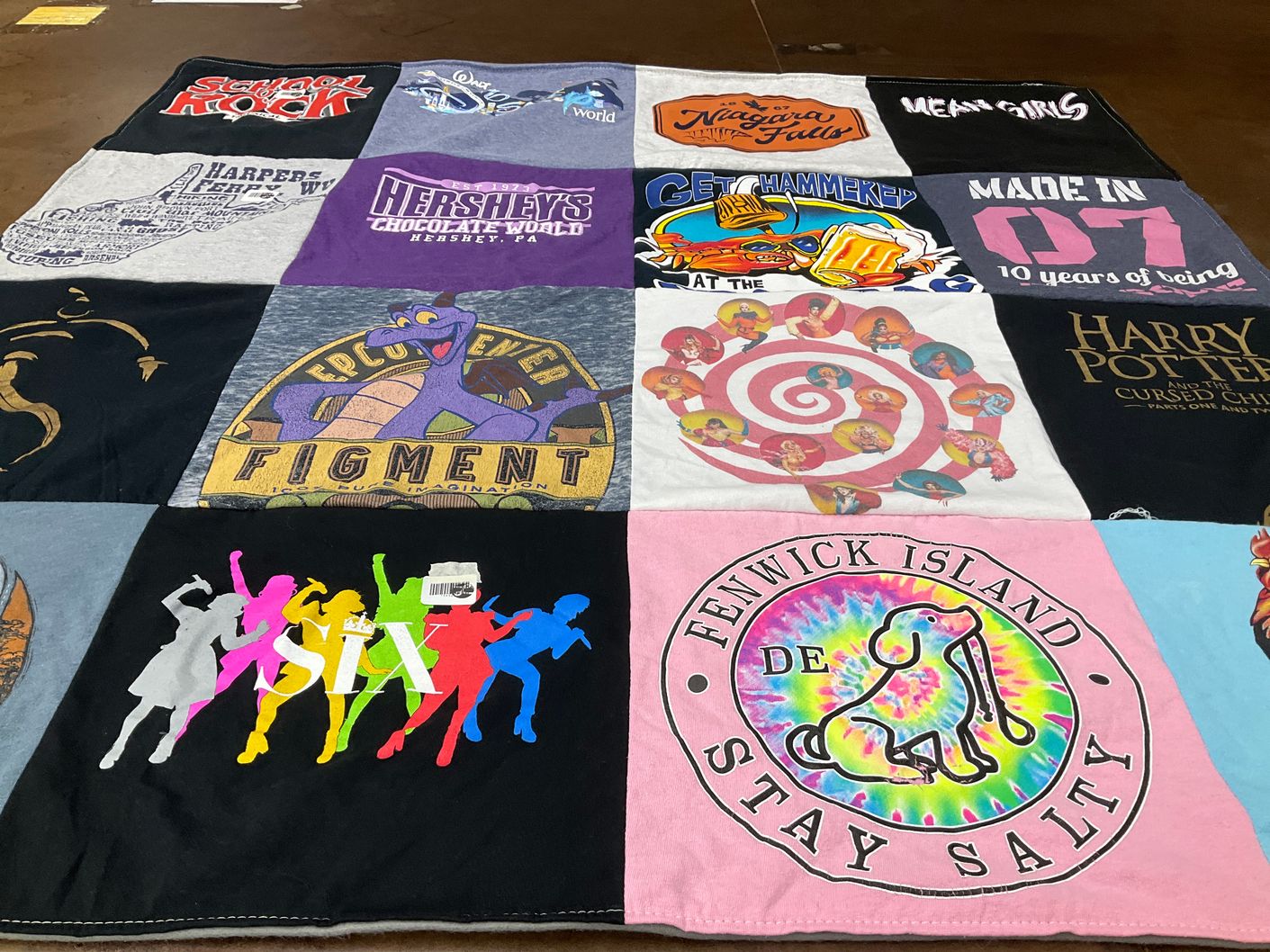 T-shirt quilt with vacation, theater themes by Allison from VA