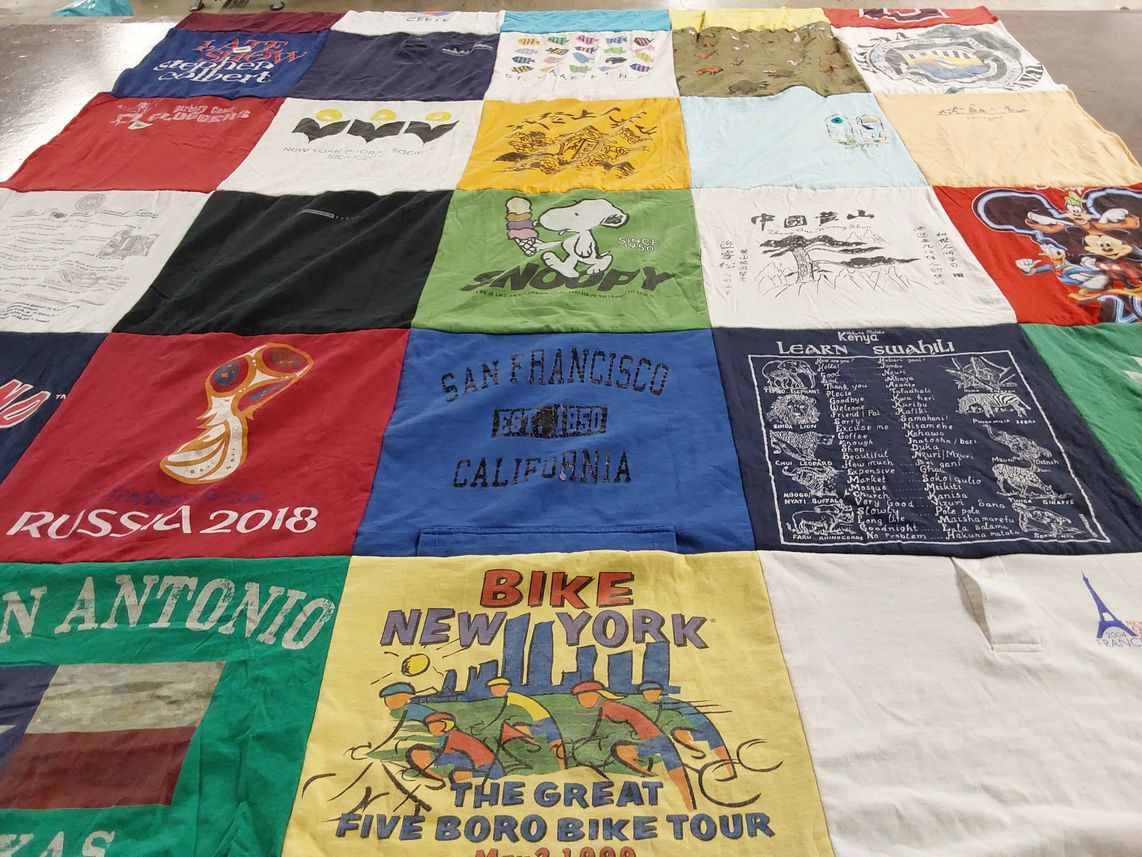 T-shirt quilt with travel, sports themes by Mary from NY