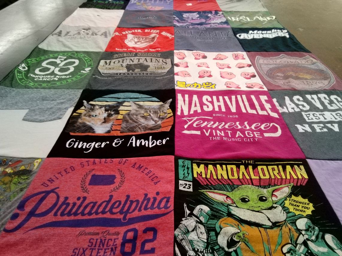 T-shirt quilt with cats, travel themes by Laraine from FL