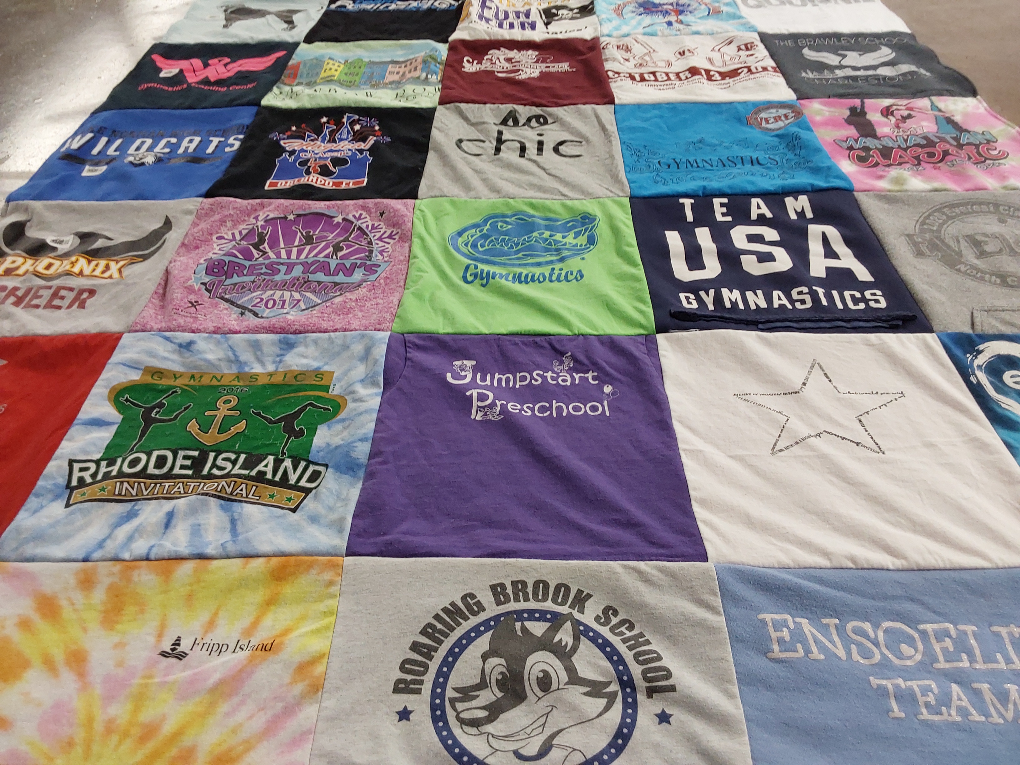 T-shirt quilt with gymnastics, sports themes by Christine MacCallum from NC