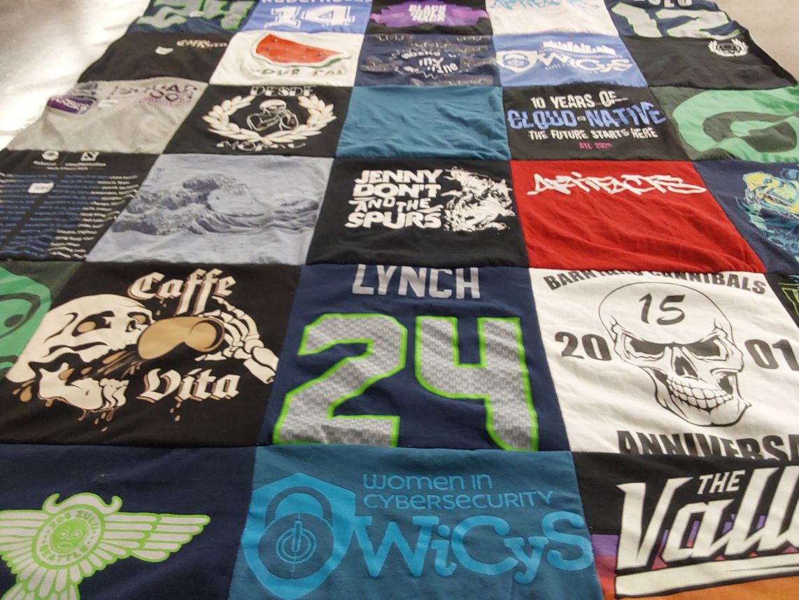 T-shirt quilt with cybersecurity themes by Crystal from AZ