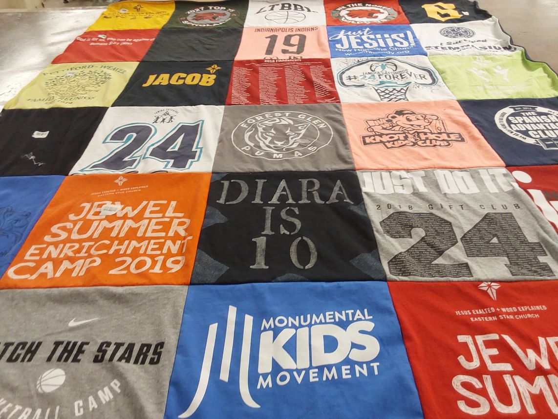 T-shirt quilt with children's programs, community involvement themes by Linda from IN