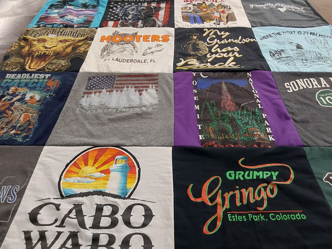 T-shirt quilt with travel, outdoor themes by Ingrid from CA