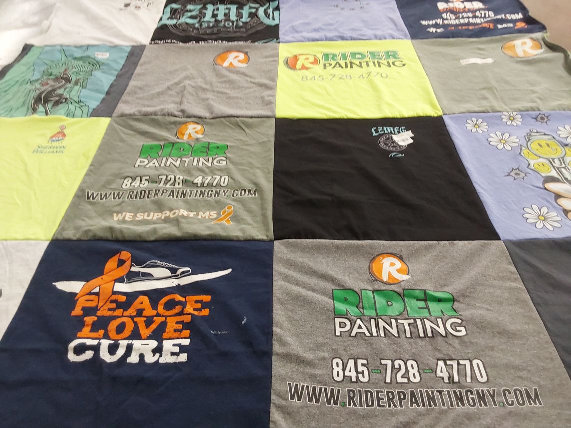 T-shirt quilt with painting, supporting causes themes by Catherine from NY
