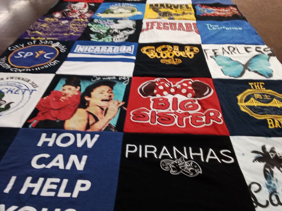 T-shirt quilt with travel, community themes by Yalile from CA