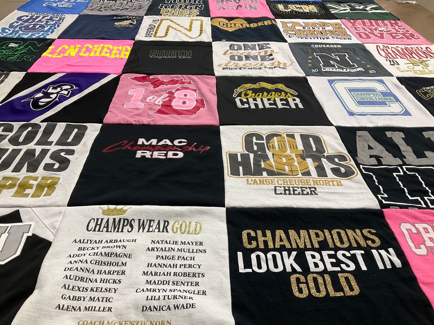 T-shirt quilt featuring l'anse creuse north competitive cheer team by Mark from MI