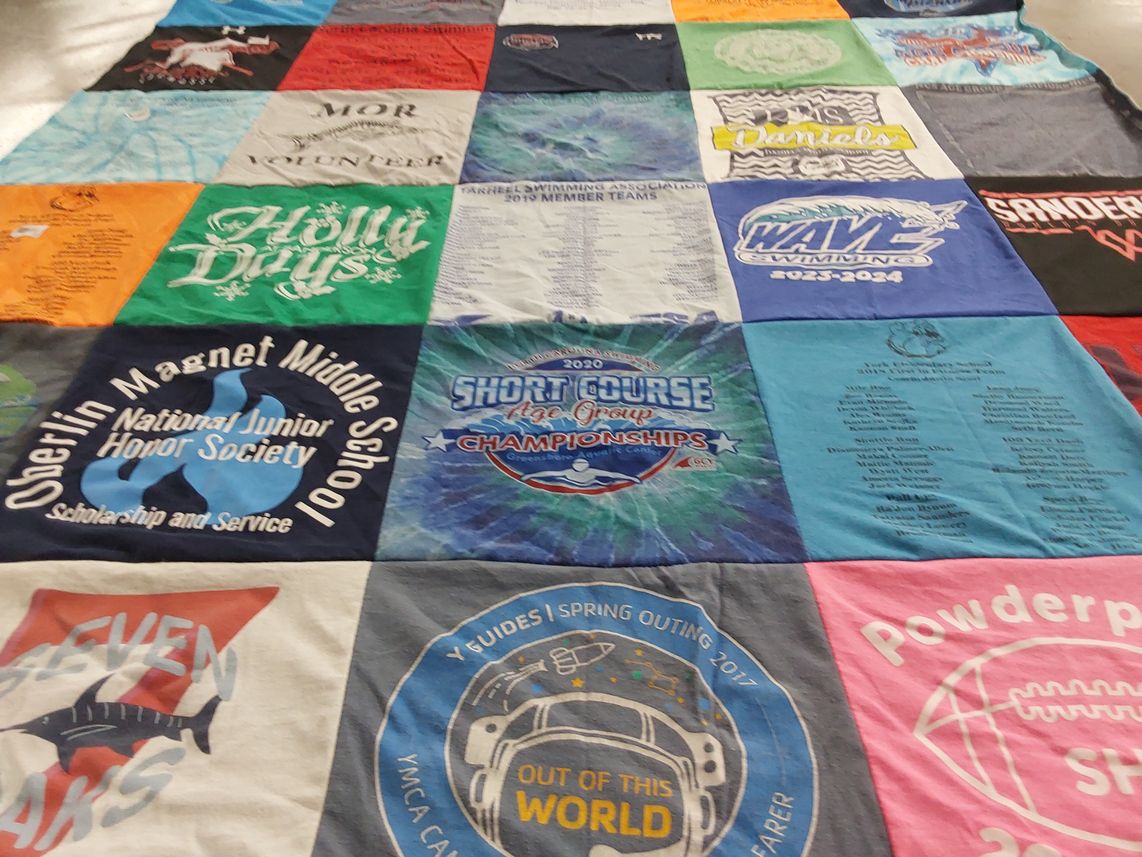 T-shirt quilt featuring wave swimming by julie from NC