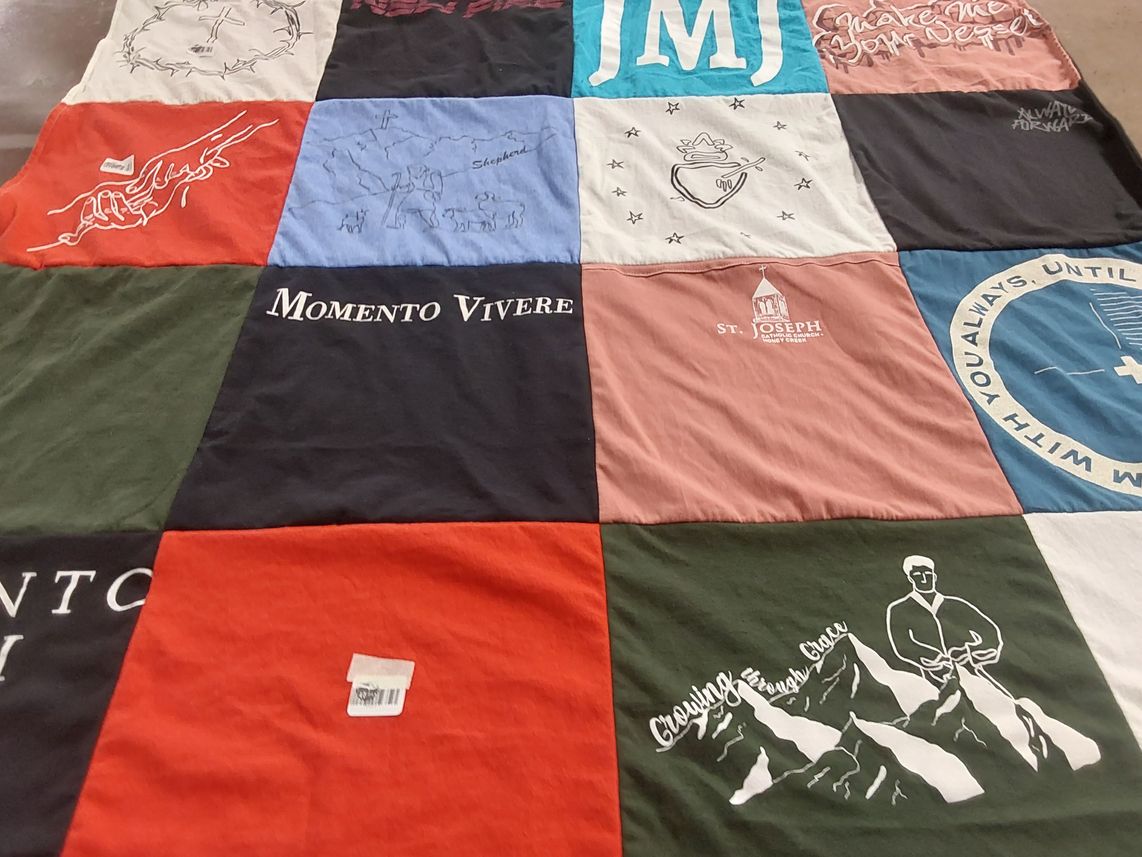 T-shirt quilt with rock climbing, spirituality themes by Sharon from TX