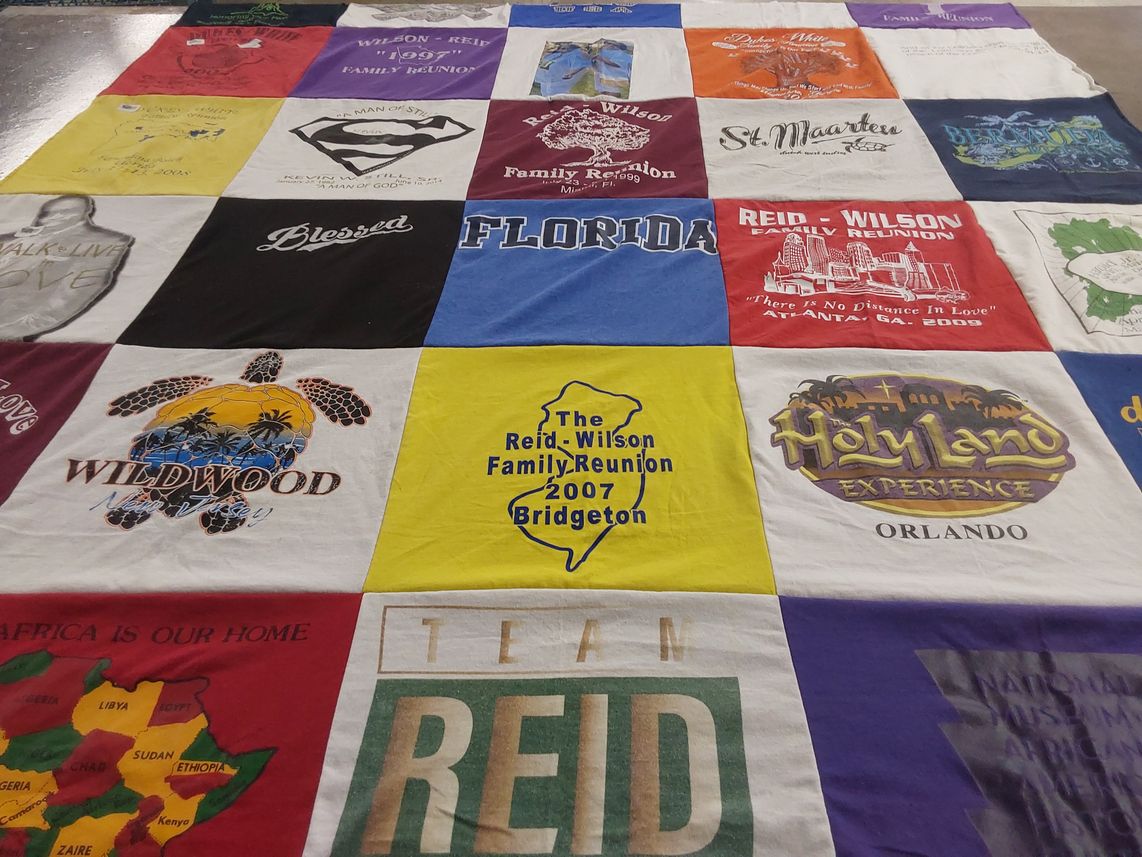 T-shirt quilt with family gatherings, travel themes by Pamela from NJ