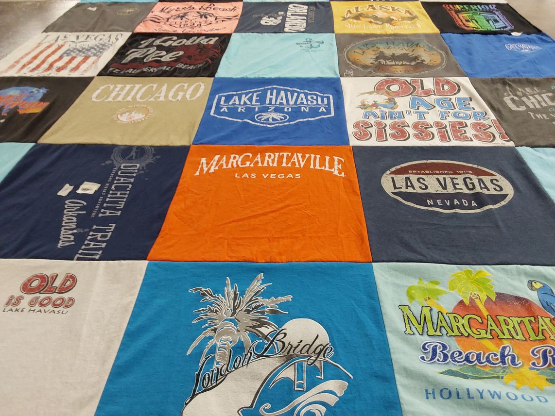 T-shirt quilt with travel, beaches themes by Merle Denise from TX