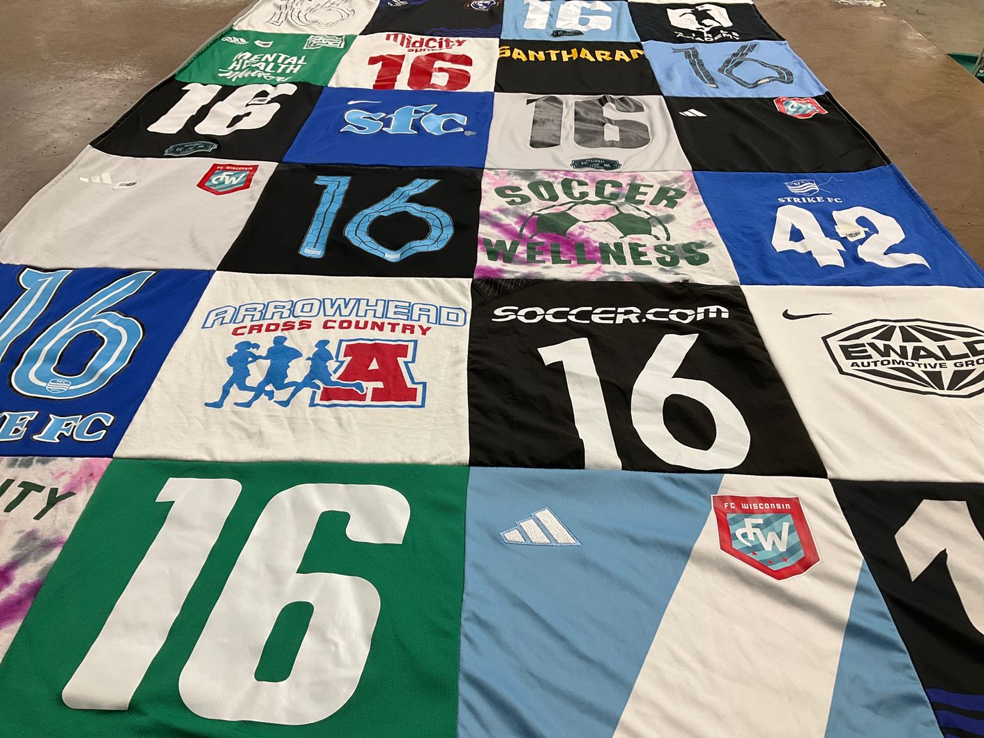 T-shirt quilt featuring fc wisconsin, strike fc by rajesh from WI