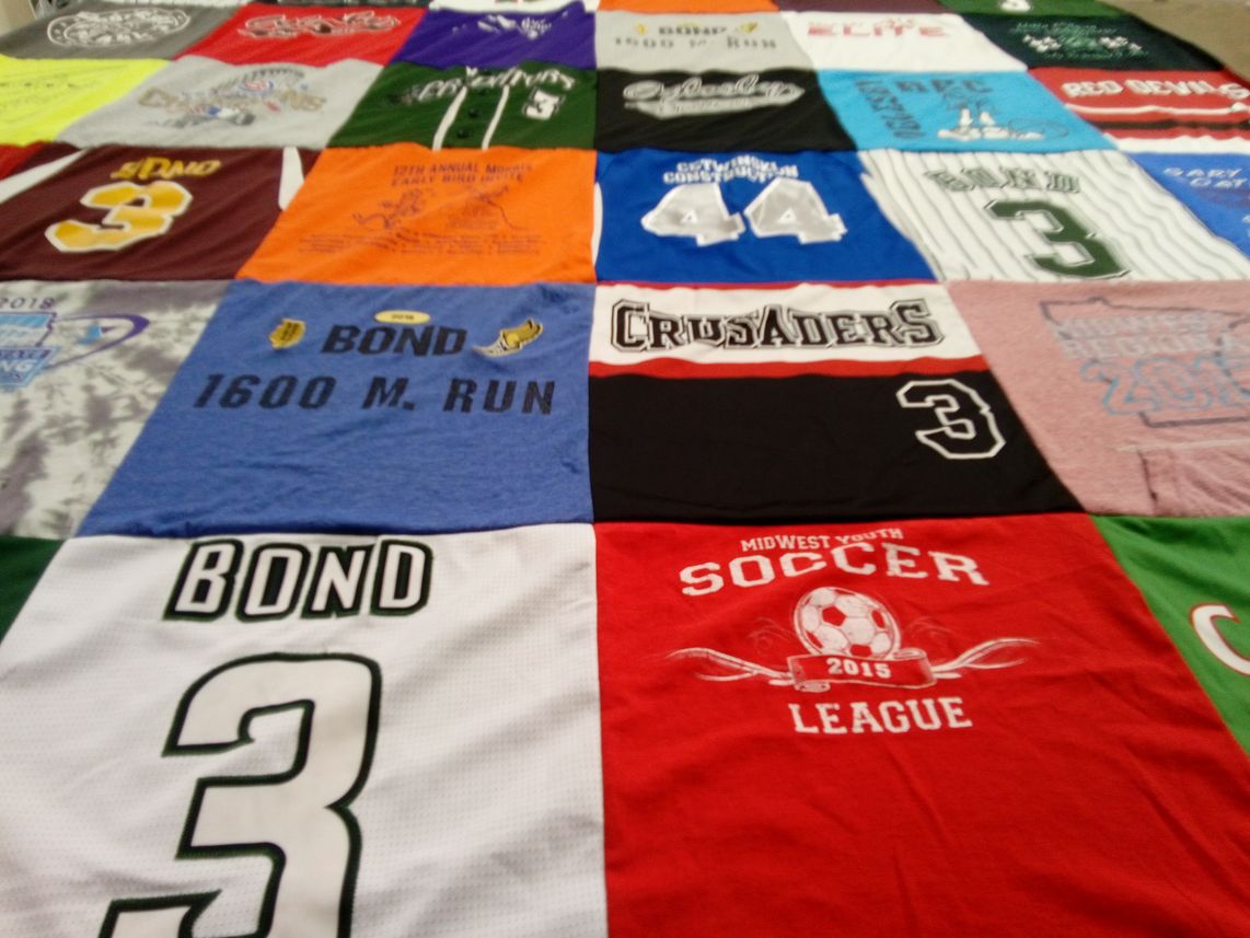 T-shirt quilt with running, soccer themes by Braylin from IL