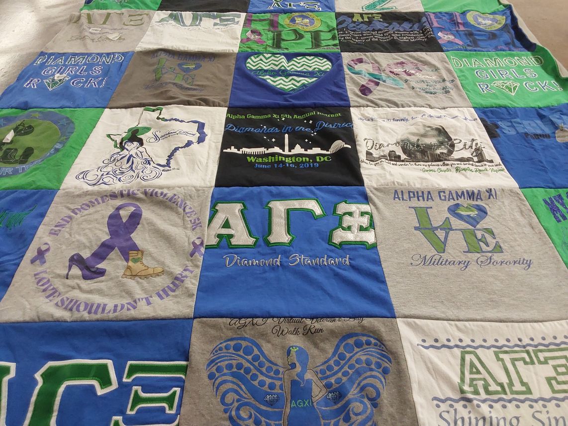 T-shirt quilt with domestic violence awareness, sororities themes by Cynthia D from VA
