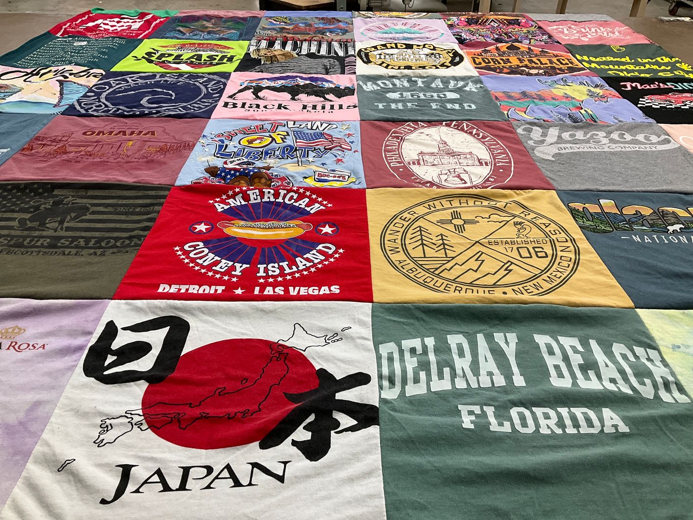 T-shirt quilt with travel, geography themes by Sophie from OH