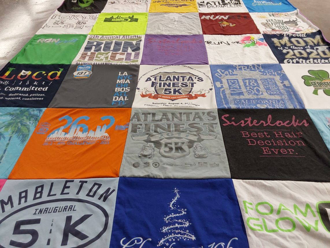 T-shirt quilt with running, haircare themes by Natalie from GA