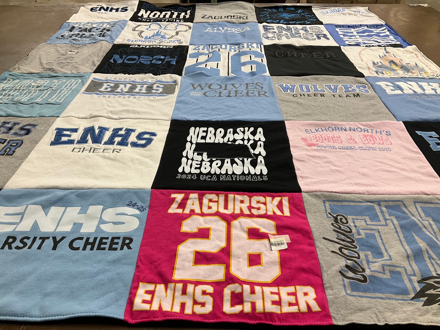 T-shirt quilt featuring elkhorn north high school cheer team, elkhorn north wolves by Stacie from NE