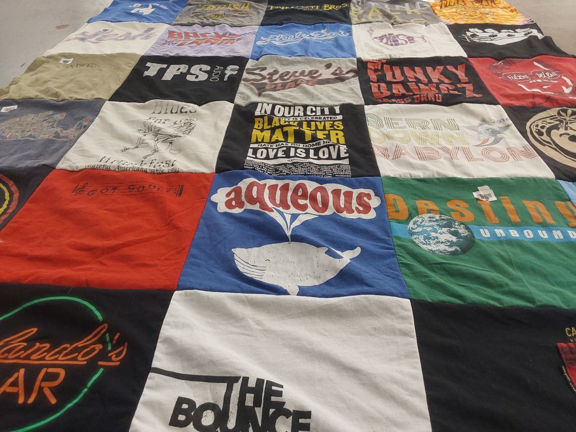 T-shirt quilt with music, community themes by Colleen from VT
