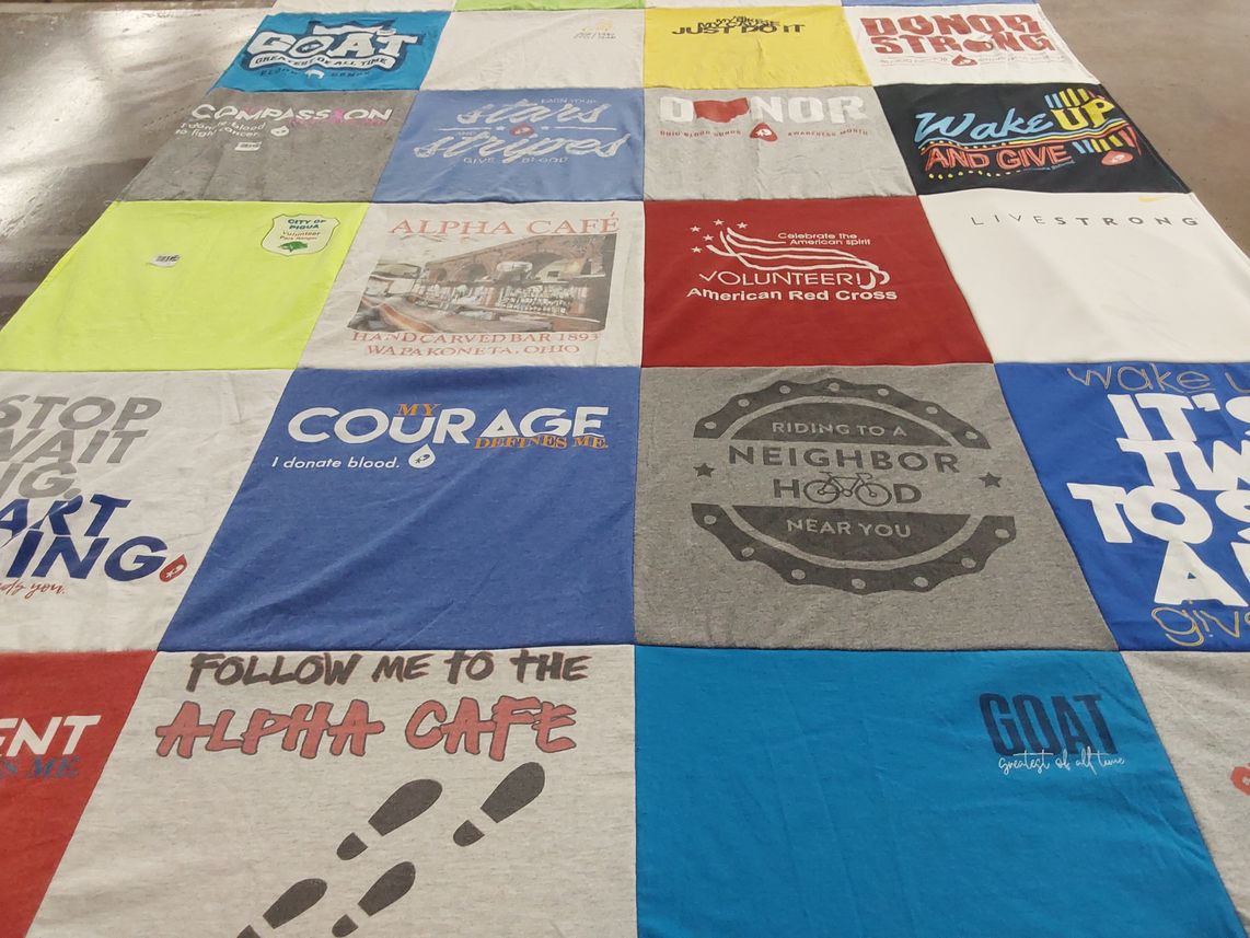 T-shirt quilt with community service, volunteering themes by Jim from OH