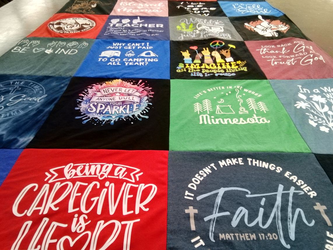 T-shirt quilt with camping, caregiving themes by Joyce from MN