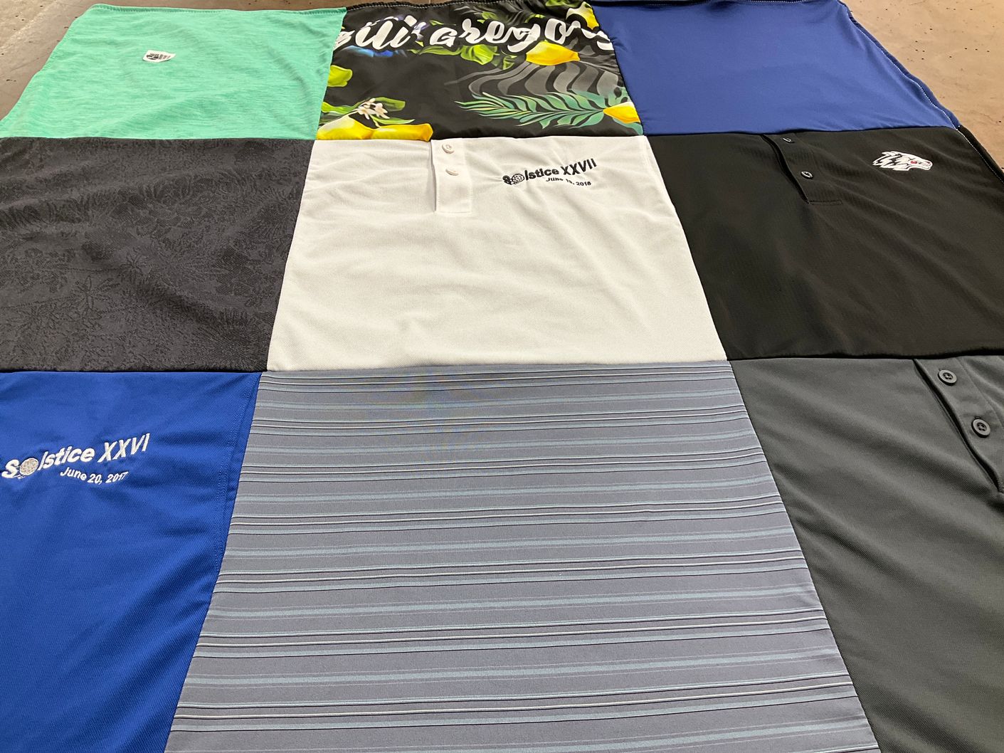 T-shirt quilt with events themes by Rivers, from NM