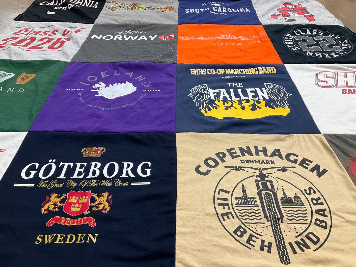 T-shirt quilt with travel, music themes by Deborah from CT