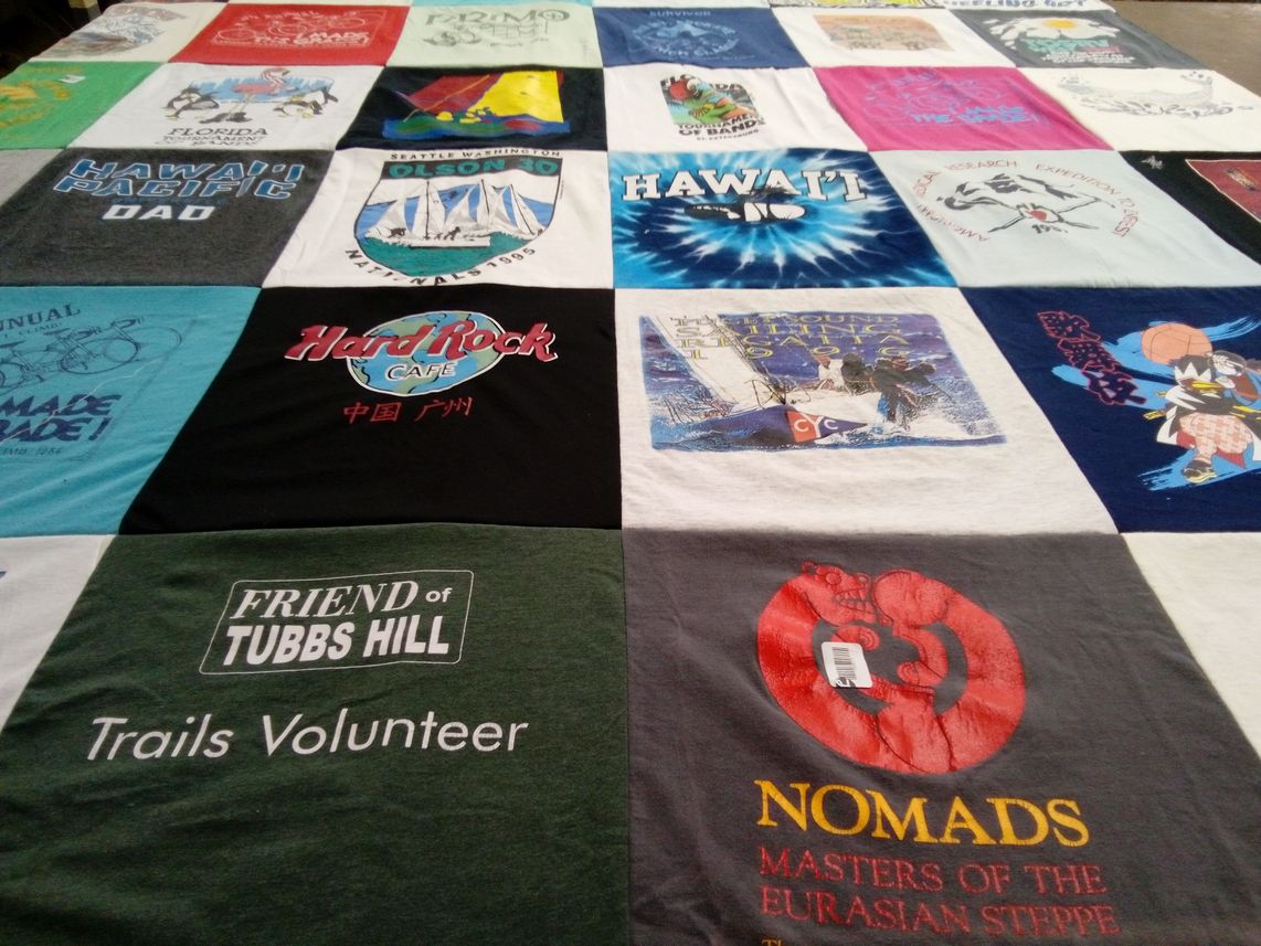 T-shirt quilt with volunteering, travel themes by Darcy from ID