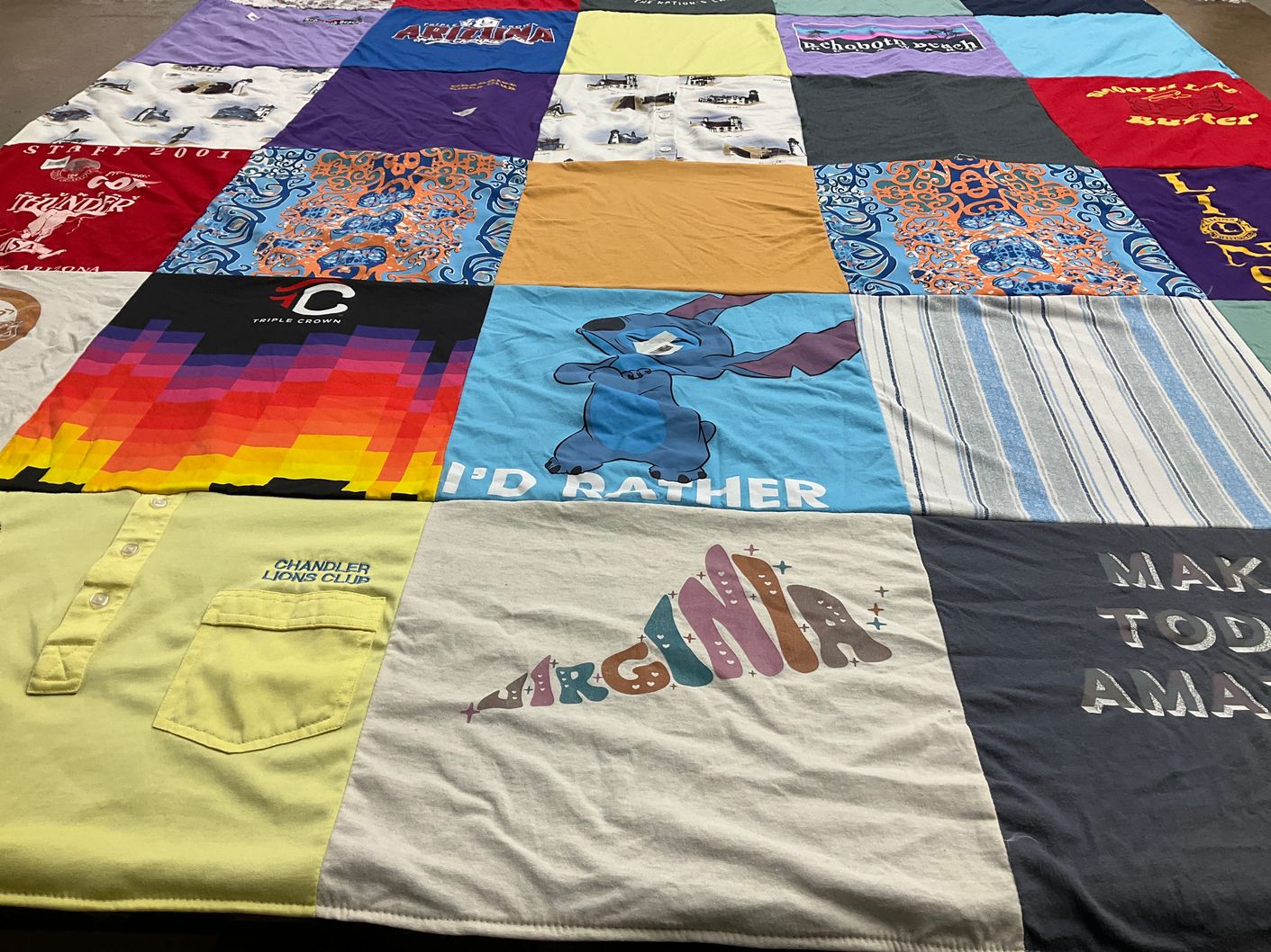 T-shirt quilt with travel, community service themes by Tabitha from AZ