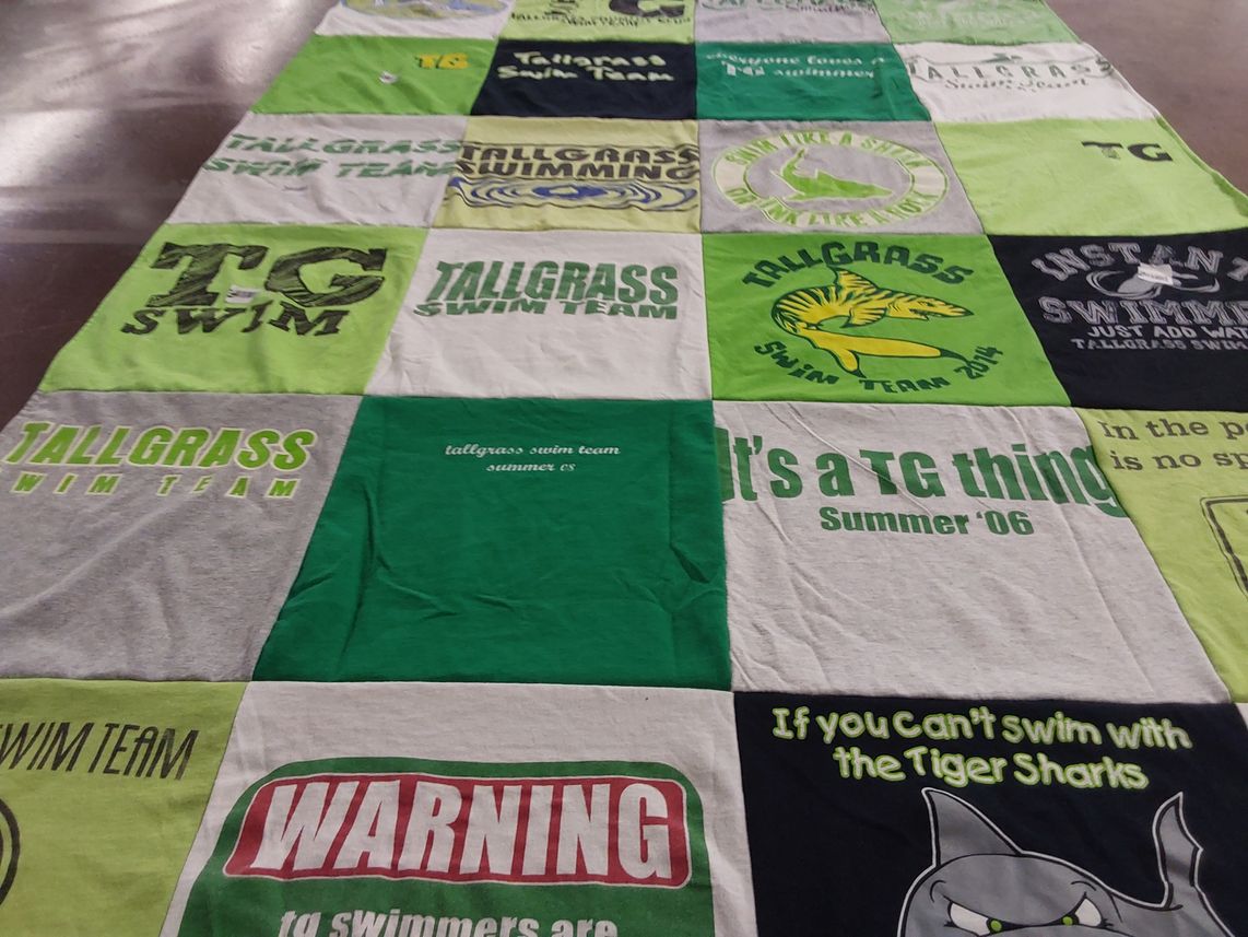 T-shirt quilt featuring tallgrass swim team by James from KS