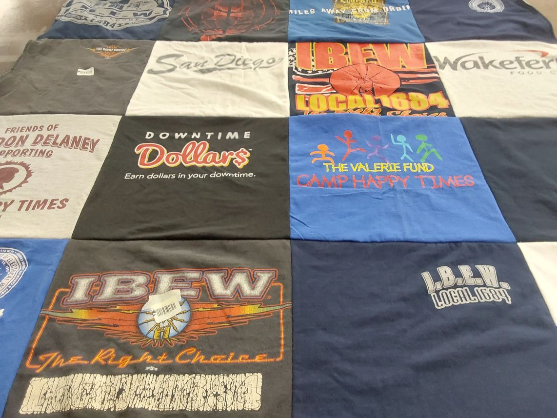 T-shirt quilt with supporting, community themes by Winnie from NJ
