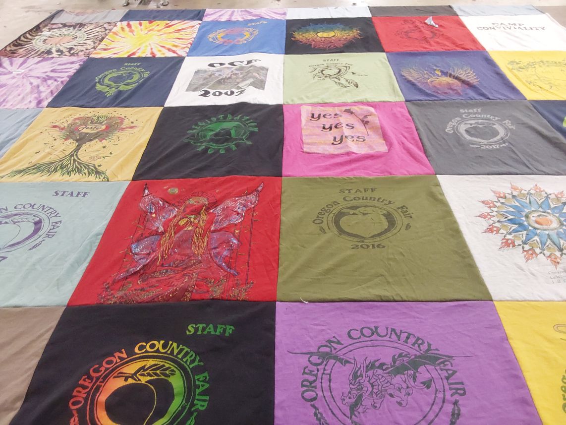 T-shirt quilt with festival, community themes by Travis from OR