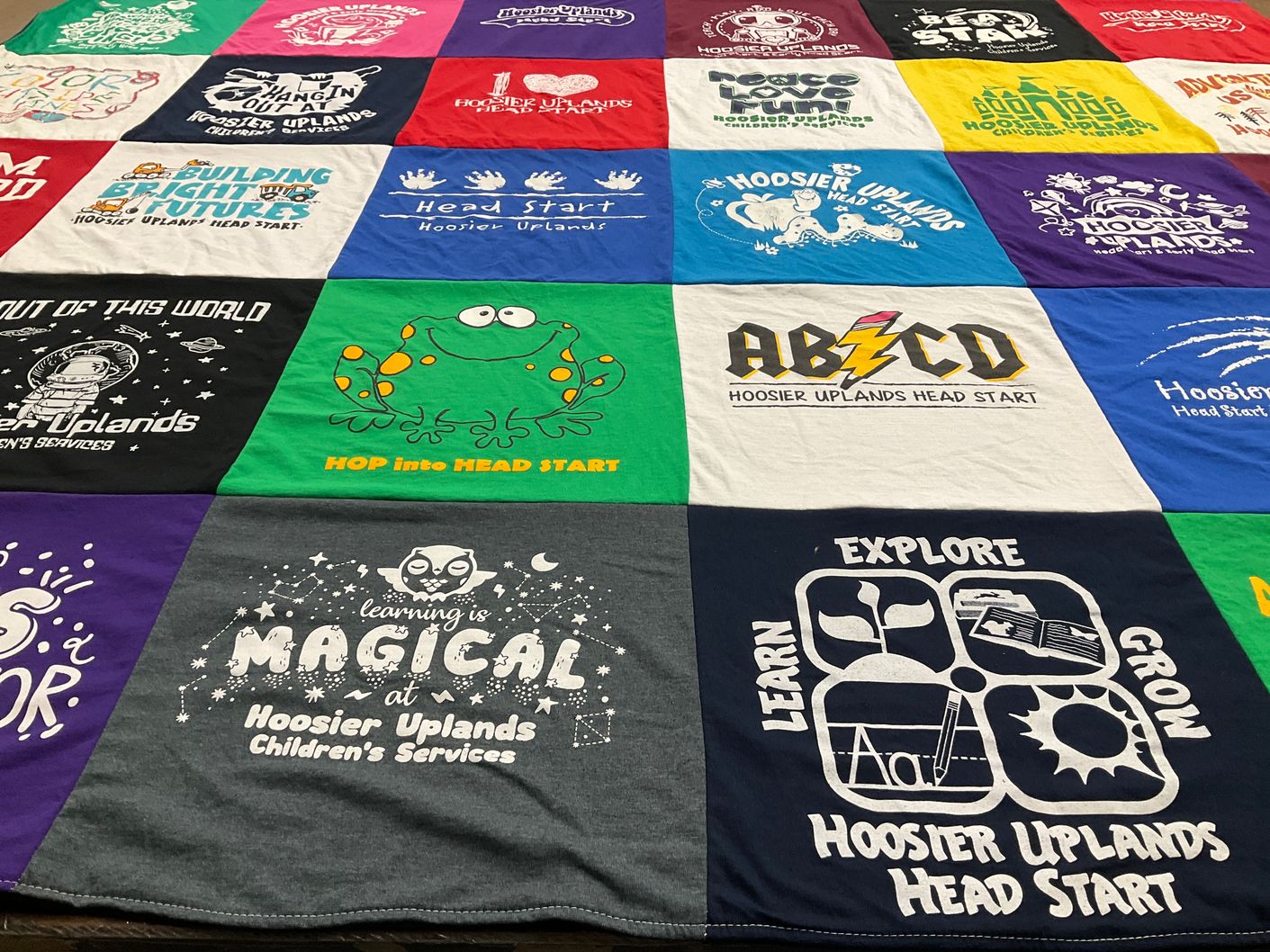 T-shirt quilt with child development, education themes by Debra from IN