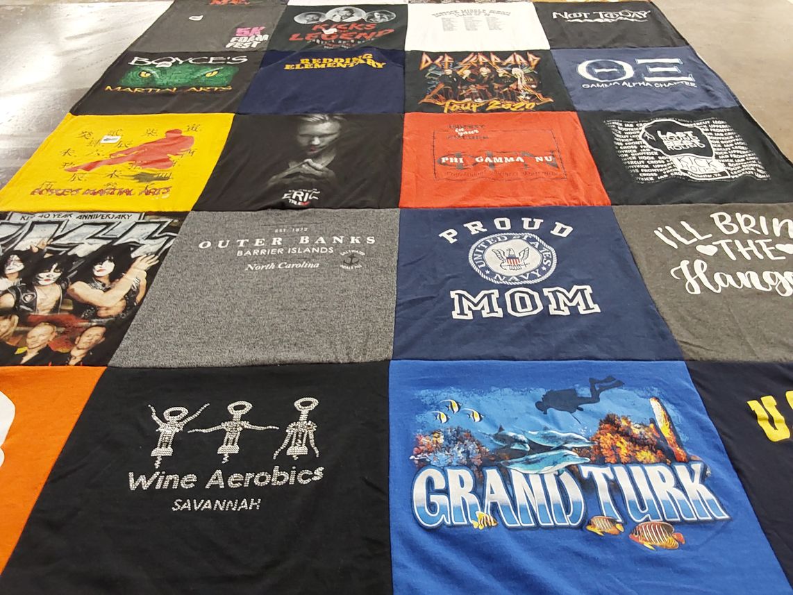 T-shirt quilt with music, travel themes by Caroline from VA