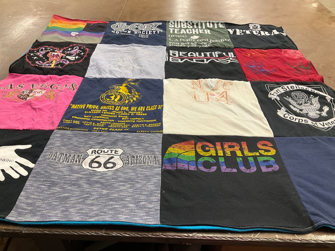 T-shirt quilt with education, veterans themes by Rosita from AZ